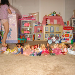 Aubri Lines Up Her Dolls.JPG