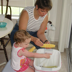 Aubri cleaning corn.jpg