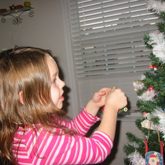 Aubri Puts on an Ornament.JPG