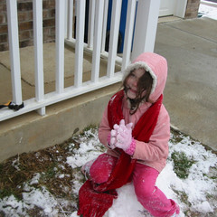 Aubri Sits on the Snow Chair.JPG