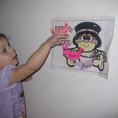 Aeryn Pins the Diaper on Baby New Year.JPG