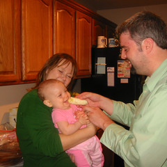Mary and Aaron Give Lil A a Banana.JPG